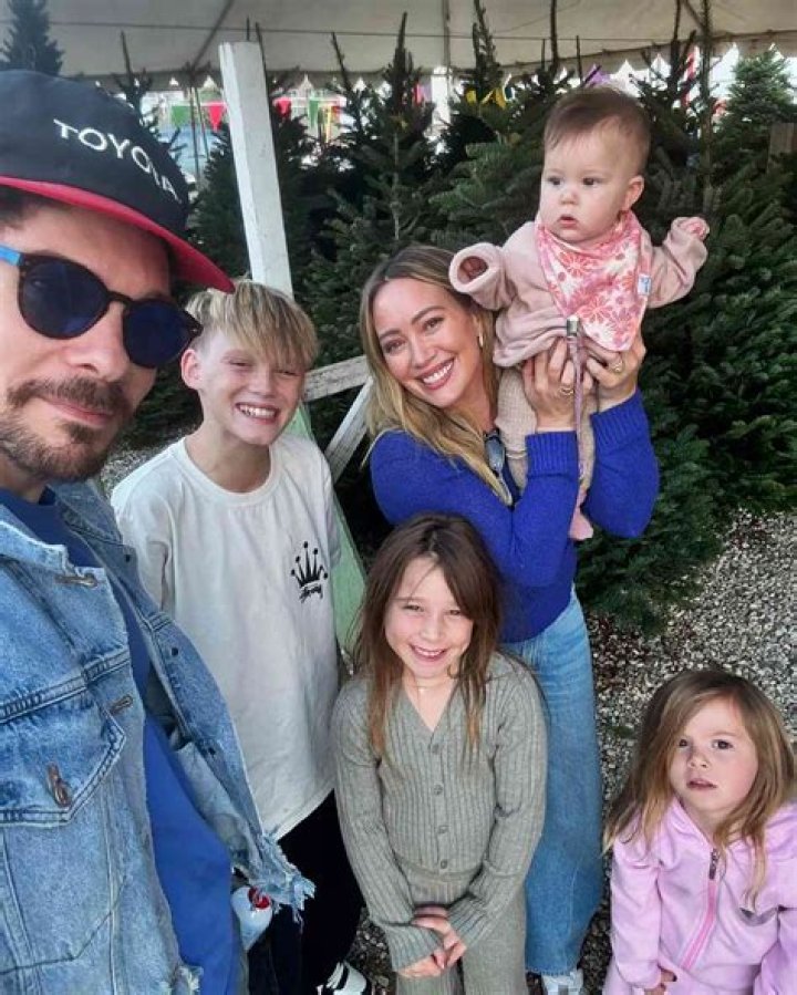 
Hilary Duff and Matthew Koma Are Held Hostage by Their Kids on the Front of Their Holiday Card 