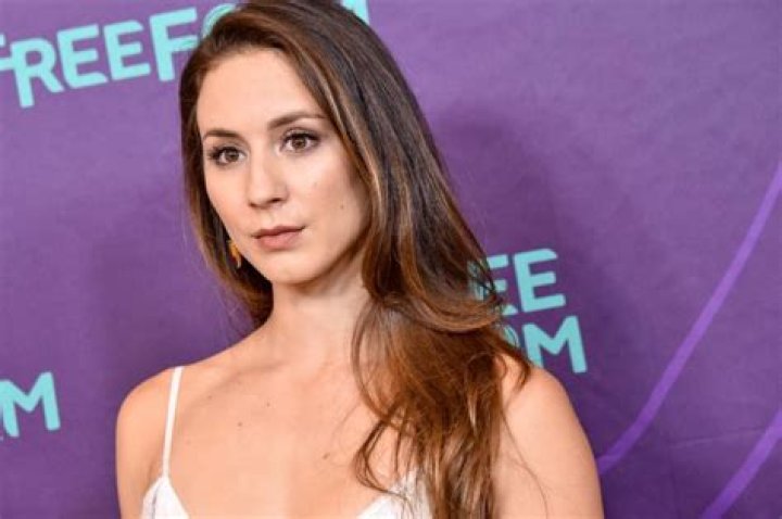 Troian Bellisario: Boyfriend, net worth, tattoos, smoking & body measurements